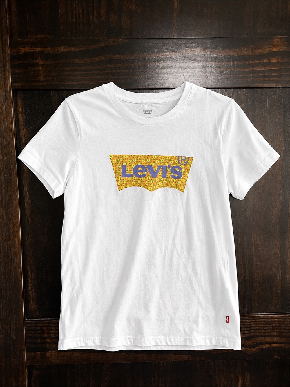 Levi's White Tee with Yellow Floral Logo and Blue Lettering